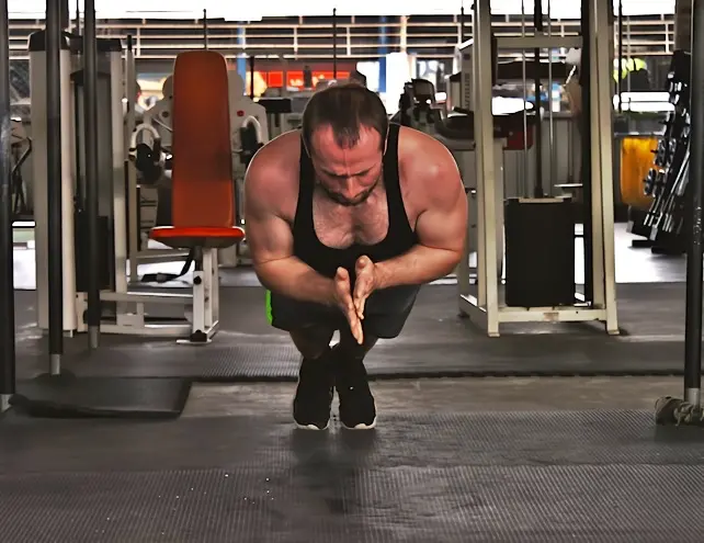 Standard clapping pushup shown from the front