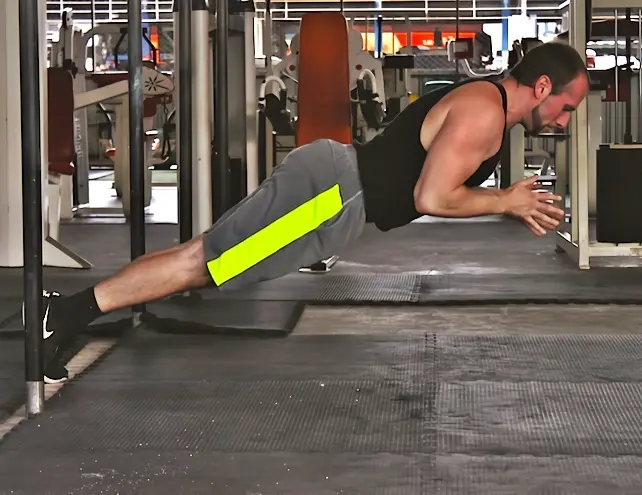 Standard clapping pushup shown from the side