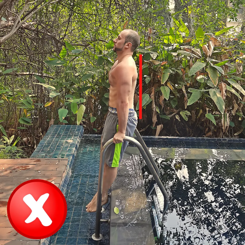 Showing improper body alignment on a parallel bar dip