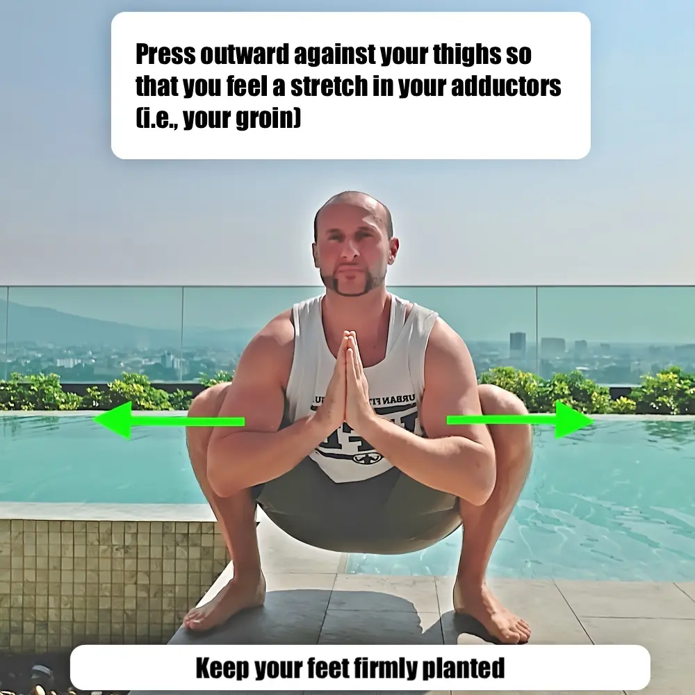 Deep squat variation using the arms to increase the stretch