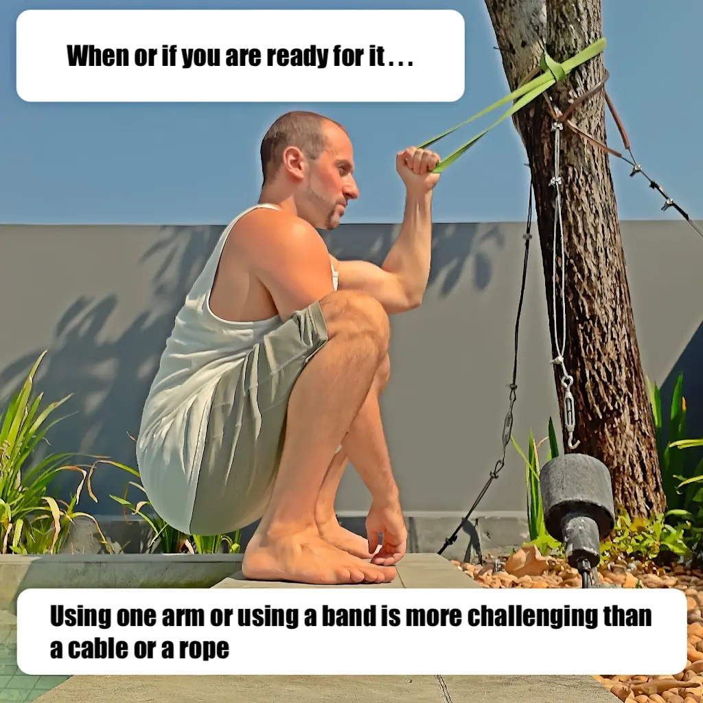 Self-assisted deep squat regression using a resistance band with one arm to hold onto
