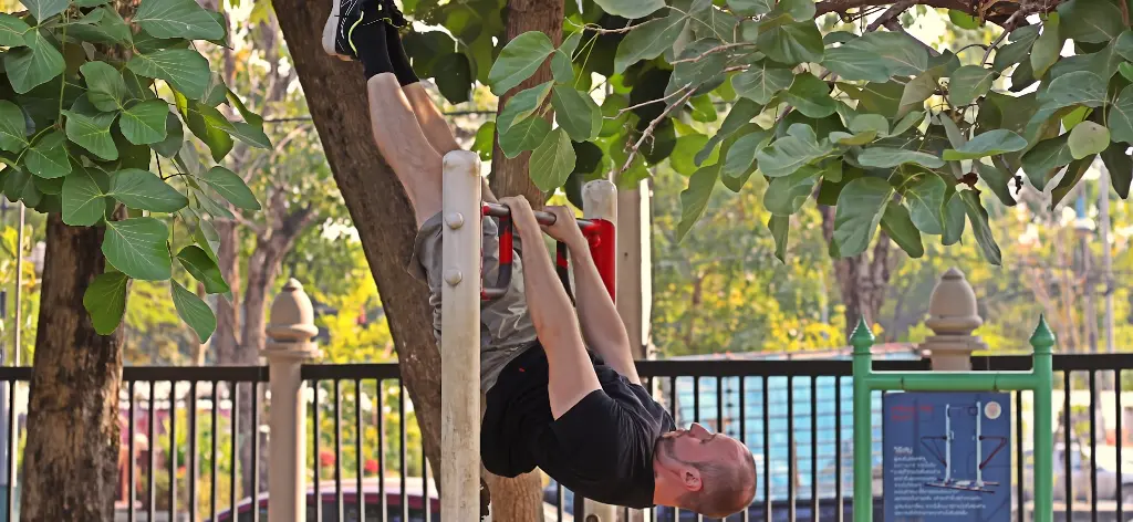Slanted front lever on a pullup bar at an outdoor park