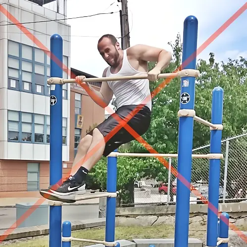 Demonstrating a chicken-wing muscleup