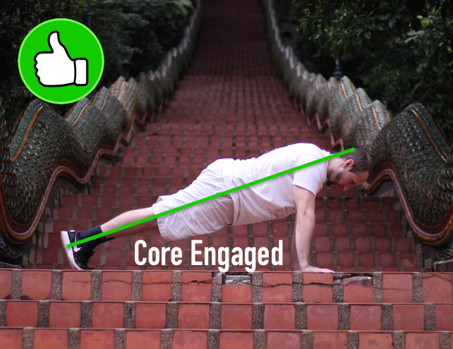 Demonstrating correct plank form, with core engaged