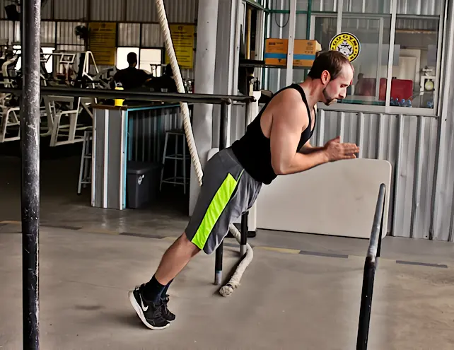A regressed clapping pushup off of an elevated surface