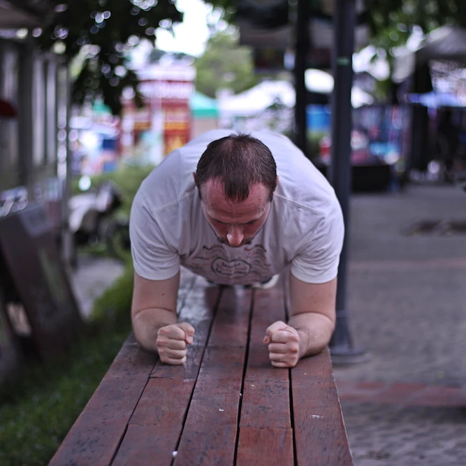 Standard forearm plank with palms facing each other