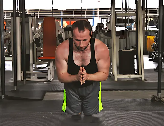 A regressed clapping pushup that utilizes the on-your-knees pushup regression and combines it with the clap