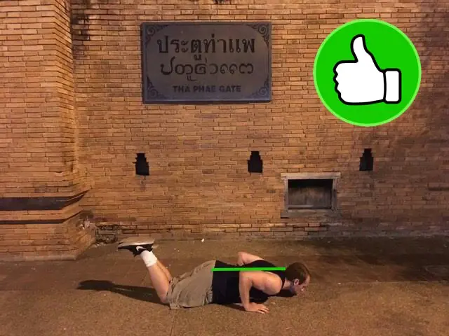 Demonstrating correct alignment in the bottom portion of the on-your-knees pushup variation