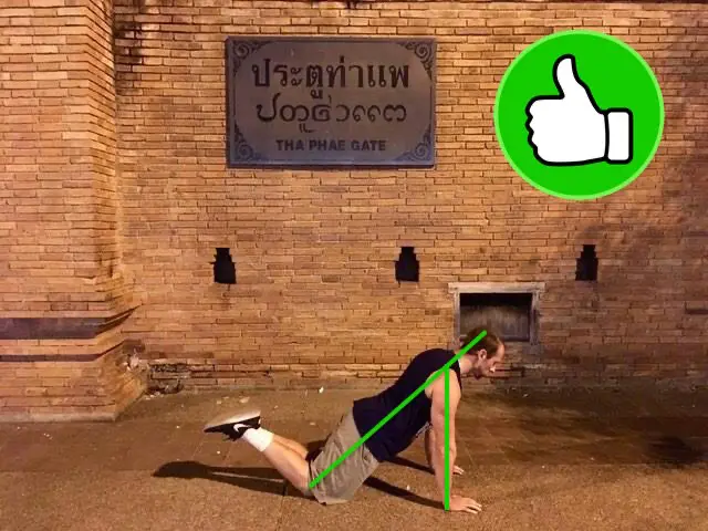 Demonstrating correct alignment in the top portion of the on-your-knees pushup variation