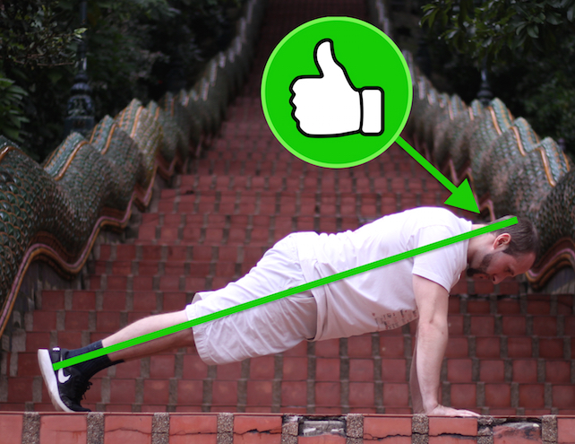 Demonstrating correct plank form, with neutral spine