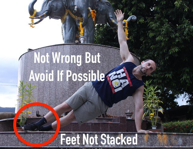 Demonstrating easier side plank form with feet not stacked