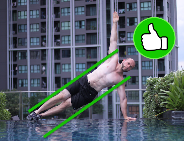 Demonstrating correct side plank form with full arm extension