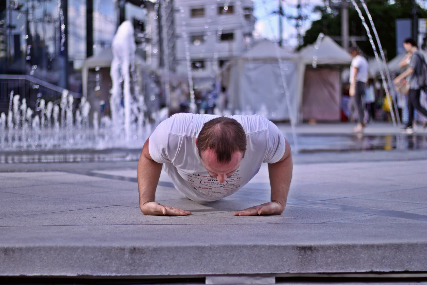 Demonstrating proper wrist pushup form in the bottom of the range of motion