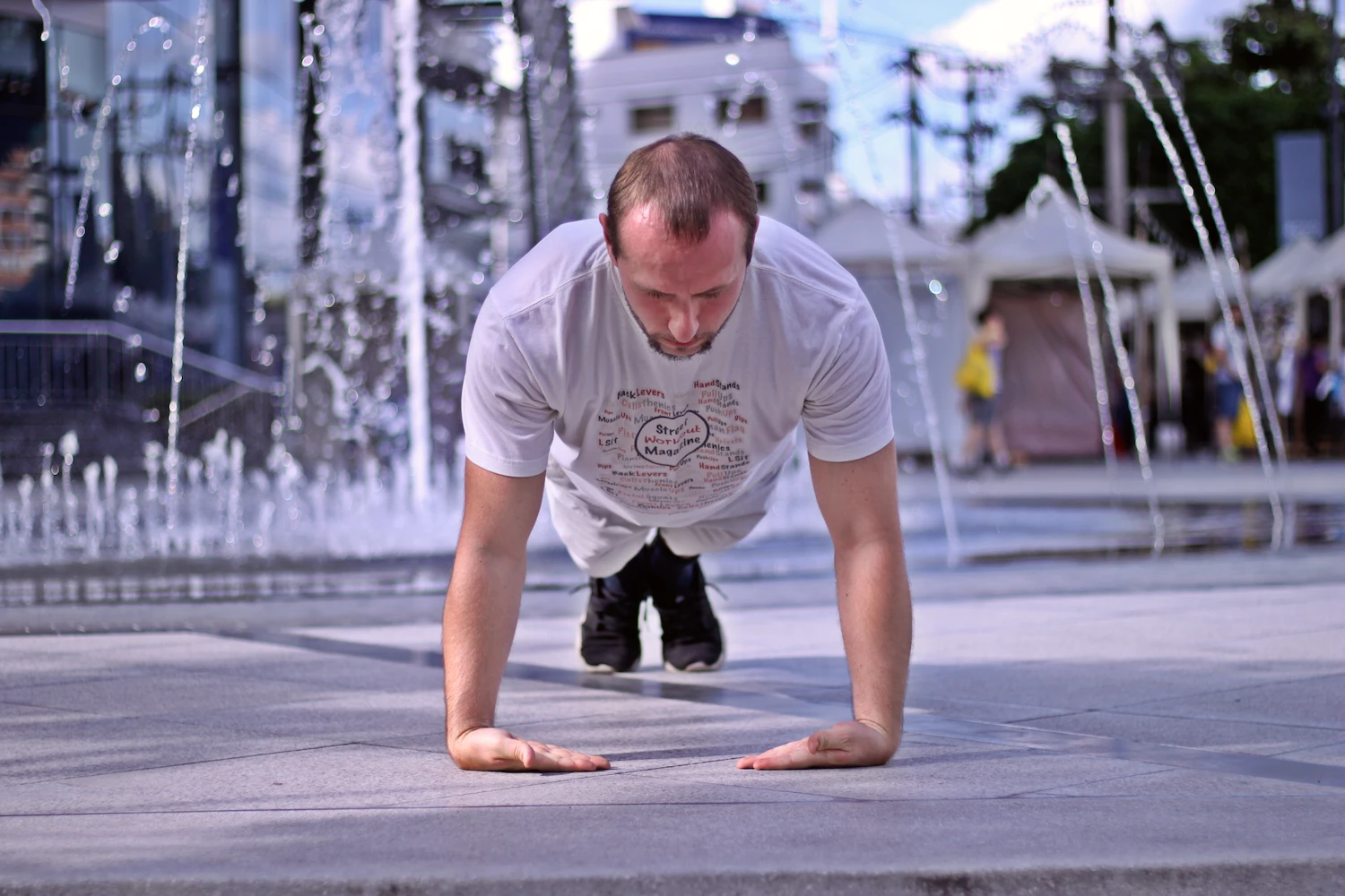 Demonstrating proper wrist pushup form in the top of the range of motion